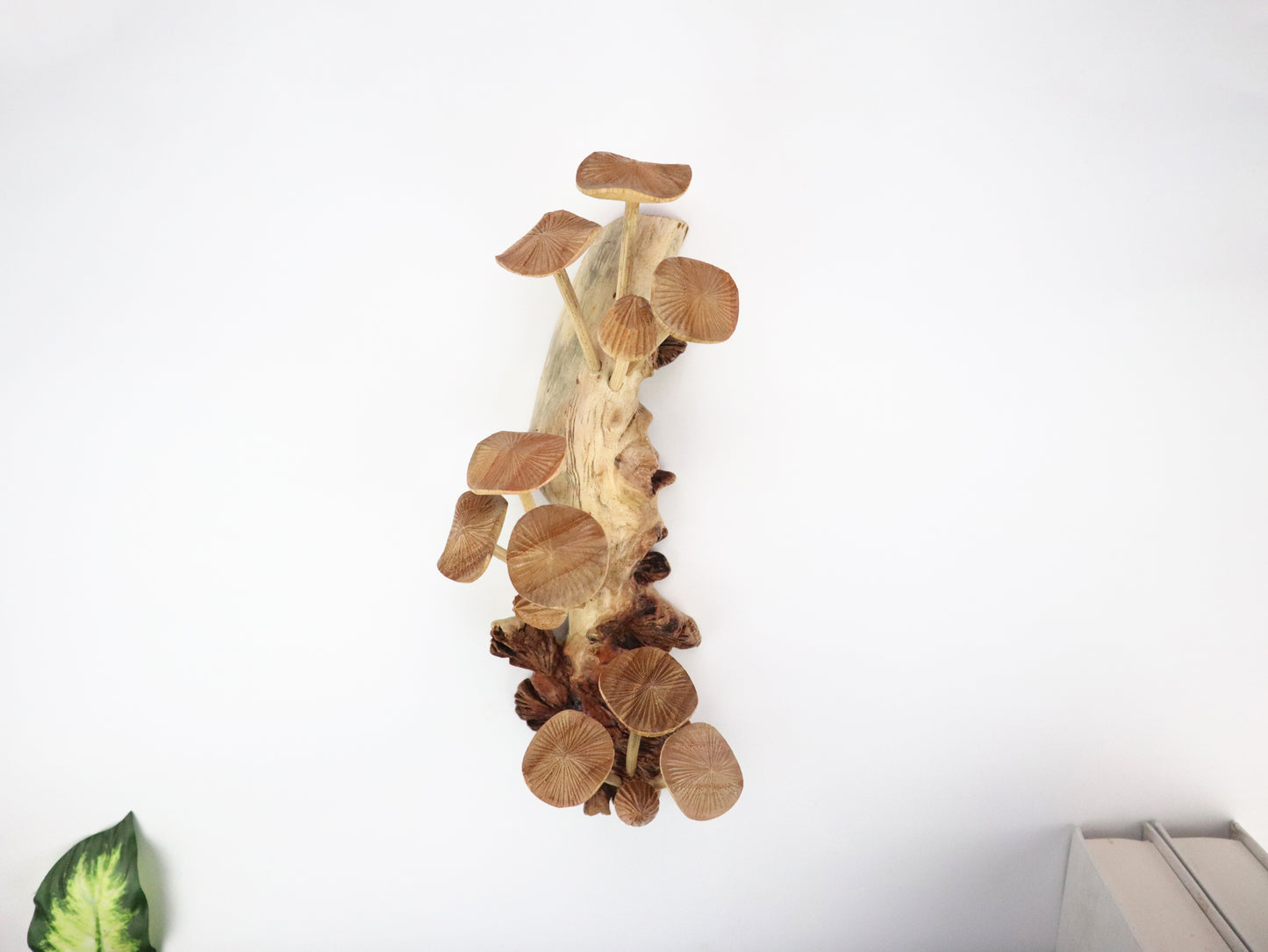 Vertical hand-carved natural wooden sculpture featuring multiple detailed mushrooms fanning out along an upright wood log or root, rustic wall art decor.