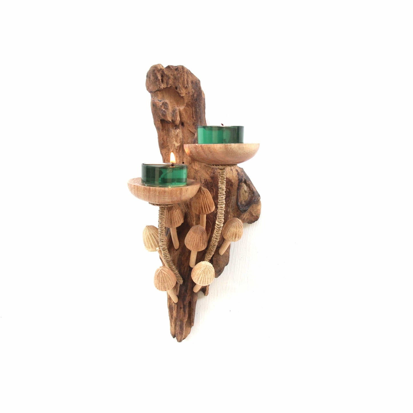 Hand-carved natural wooden wall sconce featuring a cluster of mushrooms and two candle holders with green tealights, rustic nature decor.