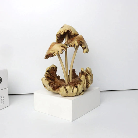 Hand-carved wooden mushroom sculpture with realistic gilled caps on natural driftwood base, handmade in Bali.