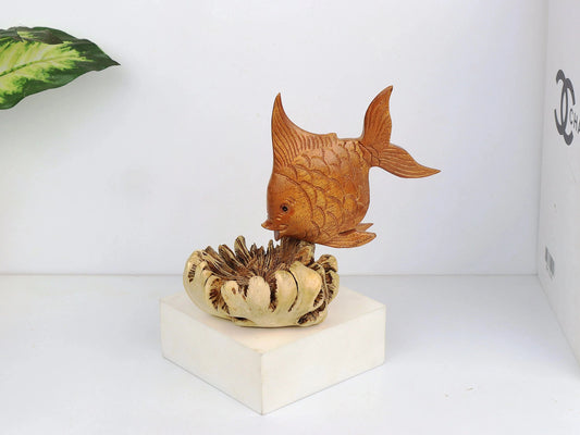 Hand-carved natural wooden sculpture featuring a fish rising from a textured, organic wood base, rustic coastal decor.