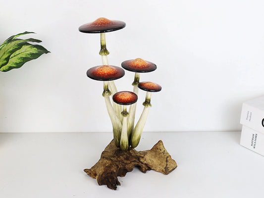 Hand-carved wooden mushroom sculpture with a cluster of five realistically painted brown-orange caps on a gnarled wood base, tabletop decor.