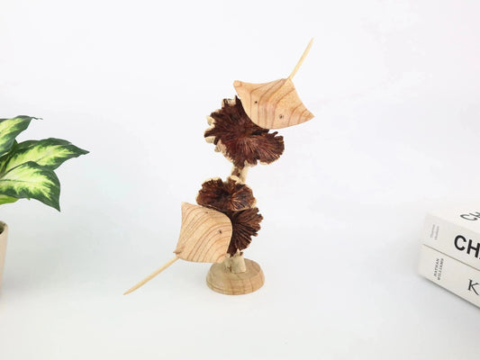 Hand-carved natural wooden sculpture featuring a single stingray on a rugged driftwood base, rustic coastal decor.