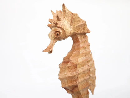 Hand-Carved Wooden Seahorse Sculpture on Natural Wood - Rustic Coastal Decor