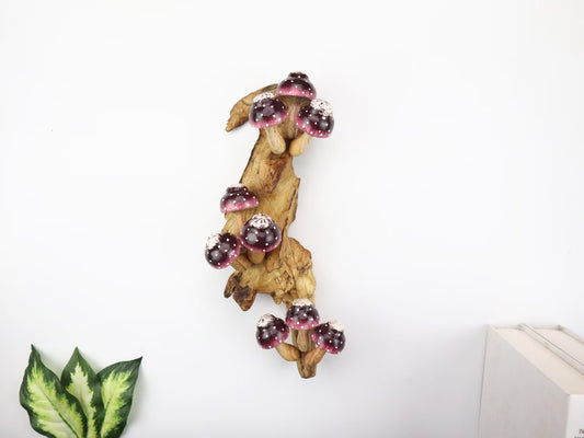 Large hand-carved natural wooden wall art featuring a dense cluster of blue and white polka-dot mushrooms on a tall upright natural wood log or root, whimsical fairy tale decor.
