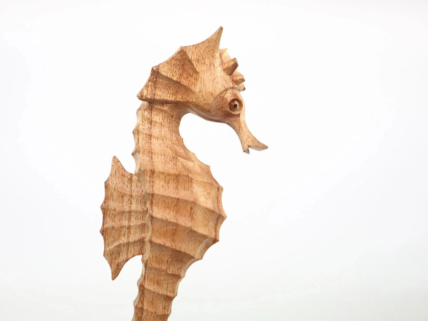 Hand-Carved Wooden Seahorse Sculpture on Natural Wood - Rustic Coastal Decor