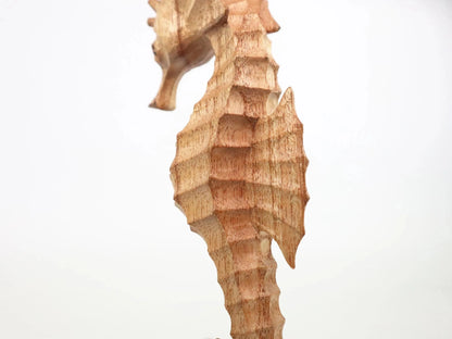 Hand-Carved Wooden Seahorse Sculpture on Natural Wood - Rustic Coastal Decor