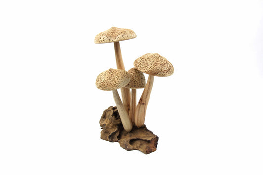 Hand-carved natural wooden mushroom sculpture with four unpainted caps on a rustic wood root base, minimalist woodland decor.